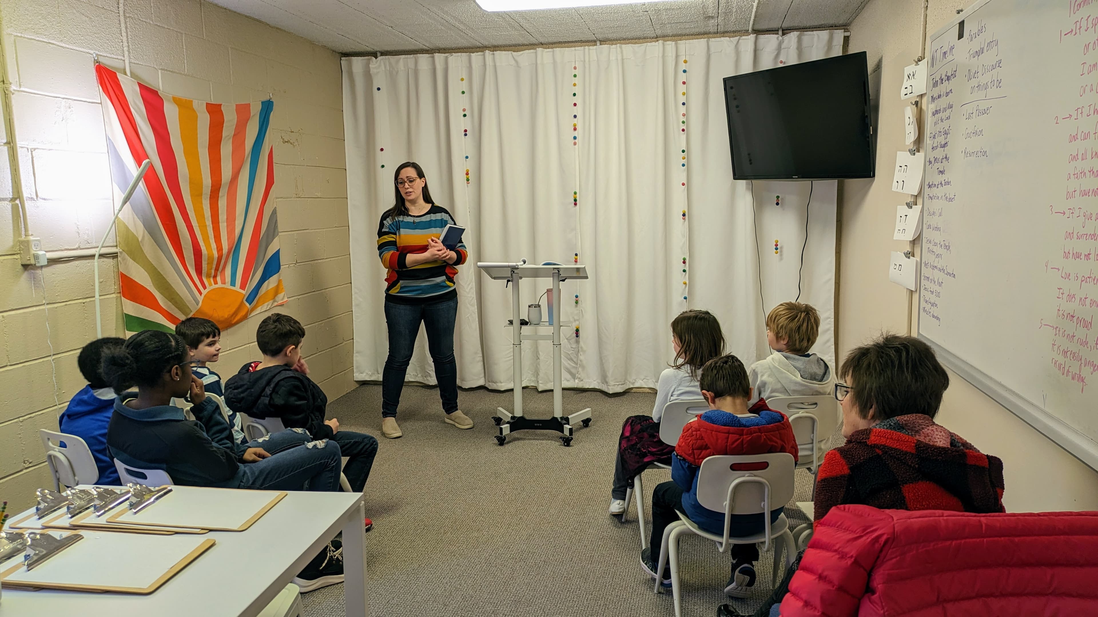 SkyWater Church kids sunday class being taught by Sarah Olson while kids sit listening